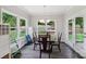 Dining room featuring large windows overlooking the backyard with play equipment at 3218 Gilroy Dr, Fort Mill, SC 29707