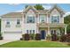 Well-maintained two-story home with a manicured lawn, blue shutters, and a welcoming front porch at 3218 Gilroy Dr, Fort Mill, SC 29707