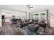 Open-concept living room seamlessly connects to the kitchen with contemporary decor and lots of natural light at 3218 Gilroy Dr, Fort Mill, SC 29707