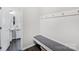 Mudroom with a bench, coat hooks, and view into the adjacent half bath at 3218 Gilroy Dr, Fort Mill, SC 29707
