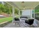 Relaxing screened-in porch with comfortable seating and a view of the landscaped backyard at 3218 Gilroy Dr, Fort Mill, SC 29707