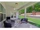 Cozy screened-in porch with comfortable seating and backyard views, perfect for relaxing outdoors at 3218 Gilroy Dr, Fort Mill, SC 29707