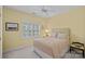 Cozy bedroom with a ceiling fan, window with shutters, and neutral decor at 3524 Rhett Butler Pl, Charlotte, NC 28270