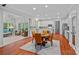 Bright kitchen with stainless steel appliances, ample cabinetry, hardwood floors, and a breakfast nook area at 3524 Rhett Butler Pl, Charlotte, NC 28270
