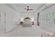Spacious main bedroom boasts trey ceiling, neutral carpet, with a ceiling fan, and natural light from shuttered windows at 3524 Rhett Butler Pl, Charlotte, NC 28270