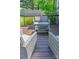 Relaxing backyard deck area with comfortable outdoor seating and a glass table at 386 Greenlea Cir, Taylorsville, NC 28681