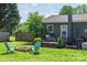 Home's backyard featuring a wooden deck, patio furniture, a grill, and firepit at 386 Greenlea Cir, Taylorsville, NC 28681