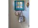 Charming wall decor with hooks, featuring a stylish mirror, hats, and a bag adding character to the hallway at 386 Greenlea Cir, Taylorsville, NC 28681