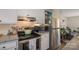 A well-organized kitchen with stainless steel appliances and adjacent living space at 386 Greenlea Cir, Taylorsville, NC 28681