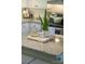 Granite kitchen island with decorative plants and accessories adding a touch of elegance to the modern kitchen at 386 Greenlea Cir, Taylorsville, NC 28681