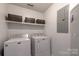 Laundry room with washer, dryer, and storage shelves at 386 Greenlea Cir, Taylorsville, NC 28681