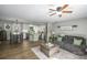 Open-concept living space featuring a kitchen island, a dining area, and comfortable seating at 386 Greenlea Cir, Taylorsville, NC 28681