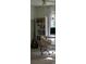This bright office features a bookshelf, desk, stylish chair, and natural light, creating an inviting workspace at 386 Greenlea Cir, Taylorsville, NC 28681