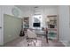 This bright office features a bookshelf, desk, stylish chair, and natural light, creating an inviting workspace at 386 Greenlea Cir, Taylorsville, NC 28681
