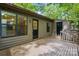 Exterior wooden back deck and entrance to a home surrounded by lush trees at 392 Tall Oaks Trl, Fort Mill, SC 29715