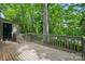 Exterior wooden back deck overlooking a beautiful, lush green forest at 392 Tall Oaks Trl, Fort Mill, SC 29715