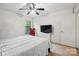Bright bedroom with ceiling fan, and large window at 392 Tall Oaks Trl, Fort Mill, SC 29715