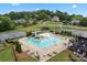 Community pool and recreation area featuring a slide, basketball hoop, and plenty of seating at 400 Maymont Dr, Cramerton, NC 28032