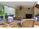 Inviting covered patio with comfortable seating, ceiling fan, and stylish decor, perfect for outdoor relaxation and entertaining at 400 Maymont Dr, Cramerton, NC 28032