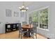 Sun-filled dining area featuring natural light, wood flooring, and a stylish chandelier at 400 Maymont Dr, Cramerton, NC 28032