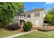 Back exterior view of home featuring a deck and patio, beautifully landscaped backyard, and convenient access points at 400 Maymont Dr, Cramerton, NC 28032