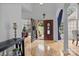 Grand foyer featuring light hardwood floors, arched doorways and high ceilings that create an inviting space at 400 Maymont Dr, Cramerton, NC 28032