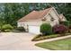 Detached garage adjacent to the home with manicured landscaping at 400 Maymont Dr, Cramerton, NC 28032