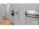 Spacious kitchen has granite countertops, stainless appliances, white cabinetry and hardwood floors at 400 Maymont Dr, Cramerton, NC 28032