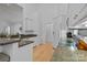 View of kitchen with granite countertops, a stainless steel sink, and dishwasher; connects to the living space at 400 Maymont Dr, Cramerton, NC 28032
