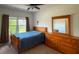 Bedroom with hardwood floors, natural light from windows, and space for a comfortable rest at 4006 Tremont Dr, Indian Trail, NC 28079