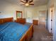 Comfortable bedroom featuring hardwood furniture, a ceiling fan, and an closet at 4006 Tremont Dr, Indian Trail, NC 28079