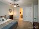 Comfortable bedroom with a ceiling fan and view of the en-suite bathroom at 4006 Tremont Dr, Indian Trail, NC 28079