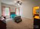 Carpeted bedroom featuring windows with curtain rods, and ample natural light at 4006 Tremont Dr, Indian Trail, NC 28079