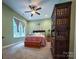 Bedroom with green walls, ceiling fan, and dark wood furniture at 4006 Tremont Dr, Indian Trail, NC 28079