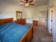 Well-lit bedroom featuring a bed, dresser, and a window offering an outdoor view at 4006 Tremont Dr, Indian Trail, NC 28079