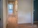 Hallway offers a neutral color scheme with carpet floors and white doors at 4006 Tremont Dr, Indian Trail, NC 28079