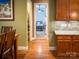 Hallway view toward a bedroom, showing hardwood floors and natural light at 4006 Tremont Dr, Indian Trail, NC 28079