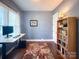 Comfortable home office featuring a desk, bookshelf, and ample natural light at 4006 Tremont Dr, Indian Trail, NC 28079