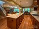 Spacious kitchen island with seating and granite counters that opens to the living area and dining area at 4006 Tremont Dr, Indian Trail, NC 28079