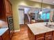 Kitchen boasts granite counters, stainless steel appliances, and open layout to living area at 4006 Tremont Dr, Indian Trail, NC 28079