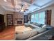 Comfortable living room featuring a stone fireplace and large sectional sofa at 4006 Tremont Dr, Indian Trail, NC 28079