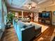 Open-concept living room featuring hardwood floors, coffered ceilings, and views of the kitchen at 4006 Tremont Dr, Indian Trail, NC 28079