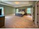 Spacious main bedroom with neutral carpet, tray ceiling, and large windows for natural light at 4006 Tremont Dr, Indian Trail, NC 28079
