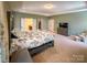 Bright main bedroom boasting a king bed, ensuite bathroom, walk-in closet, and ample space at 4006 Tremont Dr, Indian Trail, NC 28079