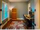 Bright home office boasts hardwood floors, large windows, and modern desk at 4006 Tremont Dr, Indian Trail, NC 28079