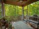 Inviting screened porch with bench and outdoor view at 4006 Tremont Dr, Indian Trail, NC 28079