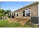 Brick house featuring an open patio area and air conditioning system at 4008 Leyland Ct, Mint Hill, NC 28227