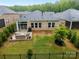 Aerial view of a fenced backyard with a cozy patio area for outdoor enjoyment at 4008 Leyland Ct, Mint Hill, NC 28227