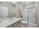 Bright bathroom featuring a sink, toilet and glass shower enclosure at 4008 Leyland Ct, Mint Hill, NC 28227