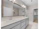 Elegant bathroom with double sinks, large mirror, and walk-in shower at 4008 Leyland Ct, Mint Hill, NC 28227